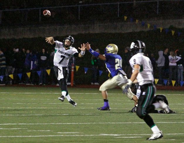09/17/10 Kentwood's Shane Green hits his reciever  Morgan Hasegawa for a first down in a drive Friday