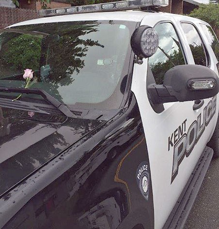 Someone placed flowers on parked Kent Police vehicles on Friday to show support for the officers in connection with the shooting deaths on Thursday of five Dallas officers in Texas.