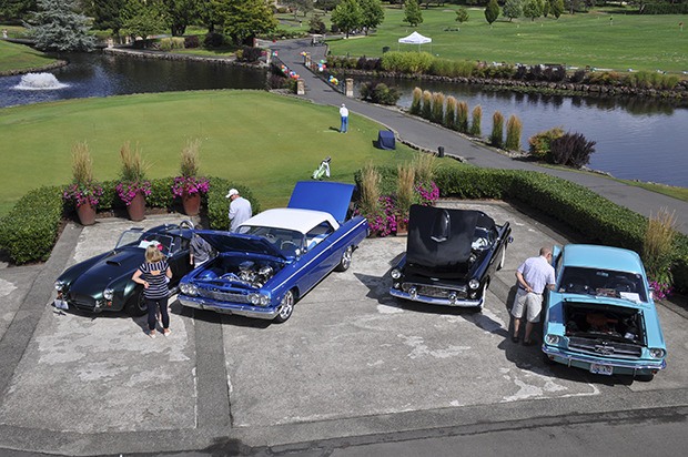 Classic models line the golf course for the Rally in the Valley car show at Meridian Valley Country Club last Sunday.