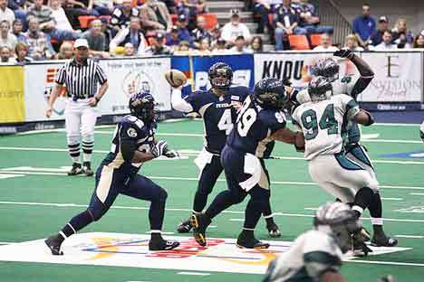 The quarterback goes for the pass in an Arena Football 2 game. Kent's ShoWare Center could be seeing a team of its own in the future