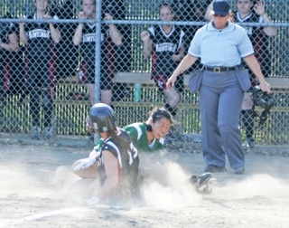 Kentridge pitcher Kelli Suguro holds her ground at home plate