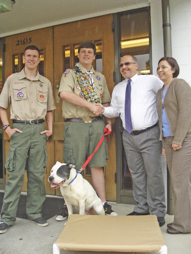 Life Scout Nathan Hansen and Eagle Scout Kory Hollingsworth of Troop 392 in Normandy Park delivered 20 dog beds to the King County Pet Adoption Center in Kent. Hollingsworth built the beds as part of his Eagle Scout project. Regional Animal Services manager Gene Mueller and RASKC operations manager Glynis Frederiksen accepted the donation.