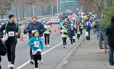 Runners and walkers participate in the 2009 Christmas Rush Fun Run and Walk in Kent. This year's run is Dec. 11 starting at the Riverbend Golf Course.