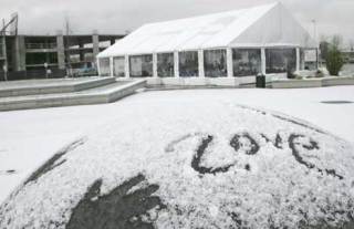 Hand prints and the word 'love' were left behind in the snow at Kent's Town Square Plaza during Thursday's snow storm.