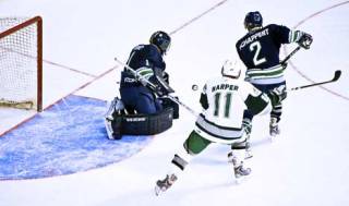Seattle Thunderbird goalie Calvin Pickard and defensemen Jeremy Schappert chase the puck in a game against Everett Oct. 25 at KeyArena. The T-Birds soon will be playing in their new home - the ShoWare Center at Kent.