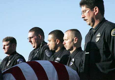 Emotional moment: Law officers operated as pallbearers Tuesday for the casket of Lakewood officer Greg Richards