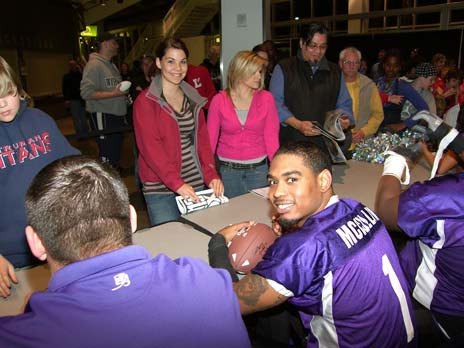 Kent Predators quarterback Charles McCullum signs autographs after an April 9 game at the ShoWare Center. McCullum threw six touchdown passes in a 55-33 win over the Tri-Cities on April 18.