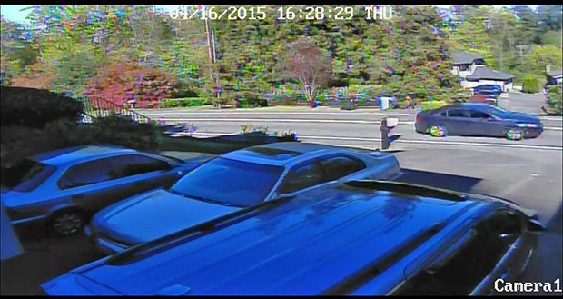 Surveillance captured the suspect's car fleeing the crime scene. Anyone with information that could help in the investigation is asked to call 911