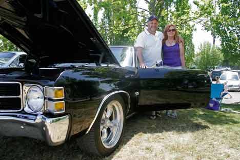 Derek and Susan Johnson show off their 1971 Chevrolet Chevelle Saturday during Kent's Fourth of July Splash at Lake Meridian