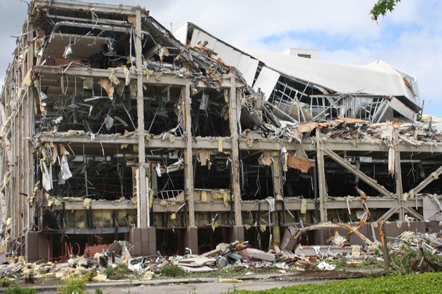 Crews in 2013 demolish a former Boeing office building at the Boeing Space Center along South 212th Street. The company announced this week more jobs will be transferred out of Kent.