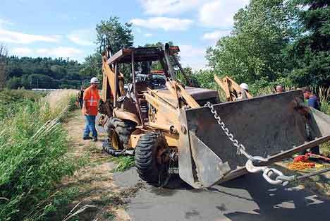 A backhoe was pulled from in the Green River in Kent Tuesday after its driver lost control of the vehicle that day along the Green River Trail. The driver