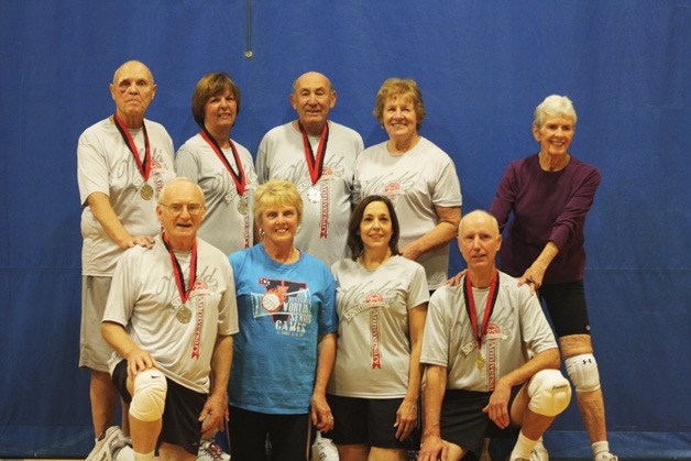 A 73 and older group picked up a silver medal at a world-wide volleyball competition. Back row