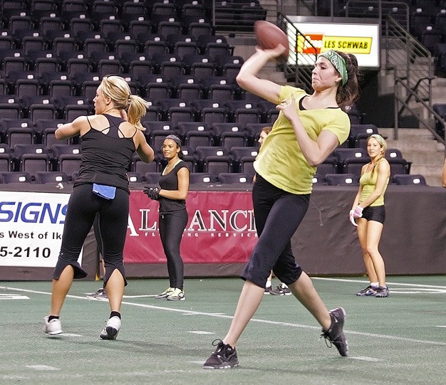 Seattle Mist quarterback Angela Rypien releases a pass at a May practice at the ShoWare Center in Kent.