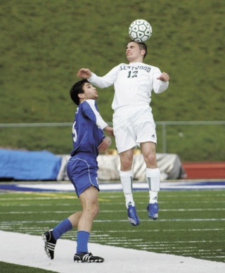 Kentwood’s Chandler Gray steps in front of Federal Way’s Nevin Hair for a header during Tuesday night’s game. Kentwood went on to win the game