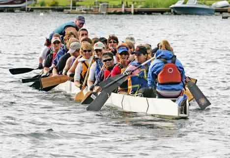 Dragon boaters take to the waters of Kent's Lake Meridian June 26 for practice. The Dragon Boat racing should be swift and popular at this year's Cornucopia Days celebration.