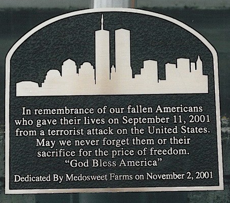 Thieves took this 9/11 plaque last month from a flag pole in front of Medosweet Farms in Kent. Police suspect someone took the plaque to sell it for its scrap metal value. The company is offering a $500 reward for its return.