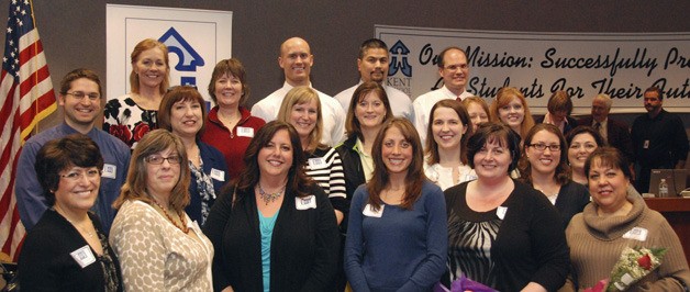 Kent School District's 2012 Class of National Board Certified Teachers celebrate together at a school board meeting Feb. 8.