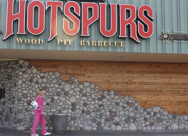 Priscilla Hoflack walks past the closed H.D. Hotspurs restaurant and bar on Washington Avenue next to the Kent Kmart. Hotspurs closed in April after 32 years.