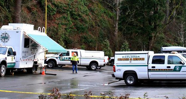 Searchers respond to an early morning Feb. 15 plane crash that killed three people near Mount Si in North Bend. The victims included Kentlake High swim coach Seth Dawson.
