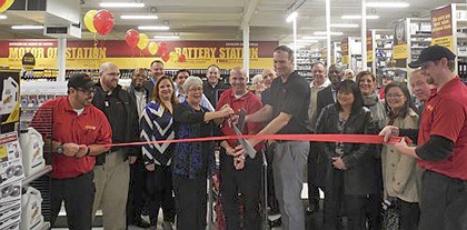 Mayor Suzette Cooke joins Advance Auto Parts management and employees in a ribbon cutting ceremony Thursday.