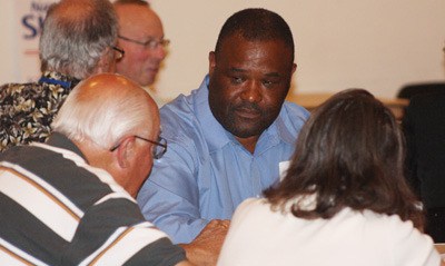 Bill Boyce listens to a question during the Kent Chamber of Commerce speed candidate and networking event July 20.
