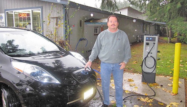 Steve Marsh charges his Nissan LEAF at Taylor Shellfish Farms
