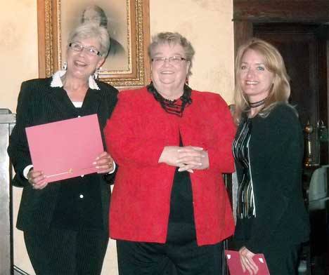 Kent Mayor Suzette Cook (from left) Greater Kent Historical Society President Charlene Shaw and Kent Historical Museum Director Linda Wagner smile during the city's 120th birthday party Friday at the museum. Cooke is holding a certificate of appreciation she received from the society