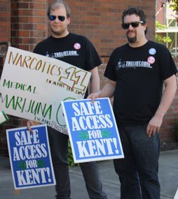 Protestors line up outside of Kent City Hall Monday