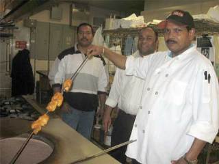The new managers and chef at Apna Dhaba restaurant