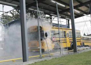 Kent School District runs a bus through its washer Aug. 27 to prepare for the start of school.