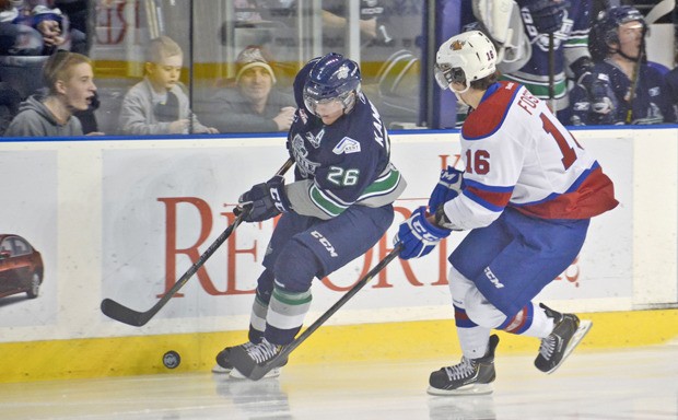 The Thunderbirds' Adam Kambeitz pushes the puck up the ice against Edmonton's T.J. Foster.