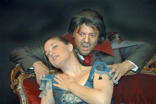 Sydney Lanier stars as Lucy and Phil Edwards as the blood-sucking count in the Auburn Regional Theatre Company's production of 'Dracula.” The show
