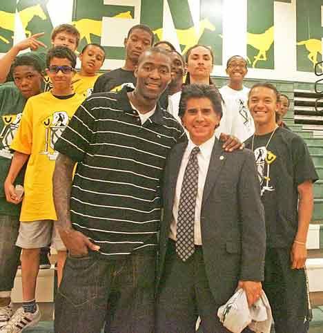 Atlanta Hawks player Jamal Crawford poses with Kent School District Superintendent Dr. Edward Lee Vargas and Youth 180 students after his presentation to the students Aug. 8.