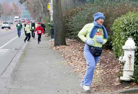Mayor Suzette Cooke rounds a bend during the Kent Christmas Rush Dec. 12. A record number of 1
