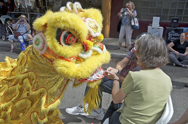 A Chinese dragon greets viewers of the Kent International Festival’s exhibitions on the Block Party’s  North Stage. The Dragon Dance was one of several displays put on by the international Festival