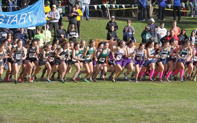 Runners from 4A West Central District take off from the finish line at American Lake Golf Course