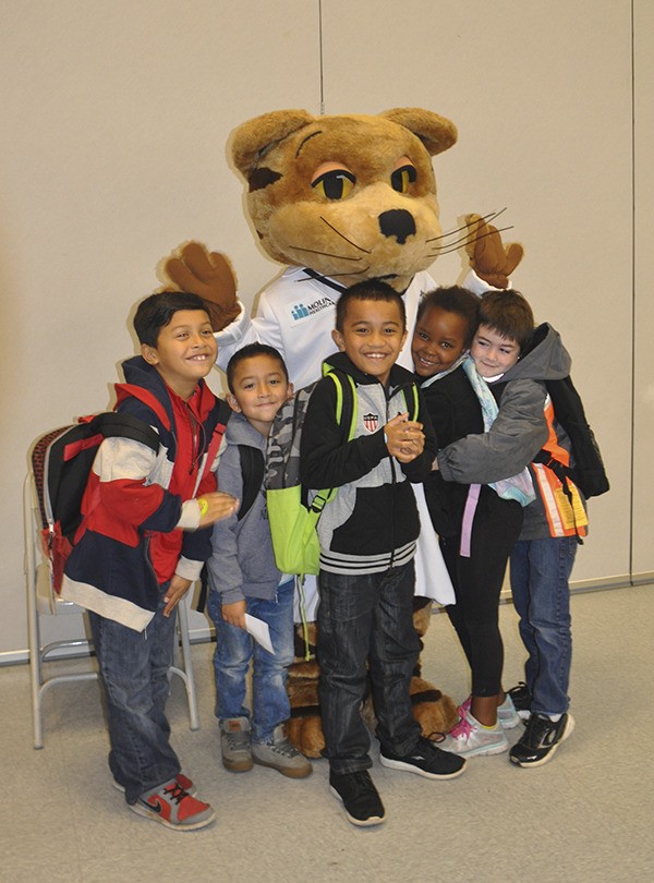 Kent Elementary first-graders hug Dr. Cleo