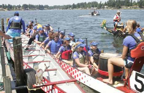 Kent Dragon Boat racing team Dragin' Tails loads its boat for a the start of a heat at the 2009 Kent Cornucopia Days Dragon Boat Races. This year