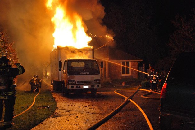 This two story Kent home was engulfed in flames when firefighters arrived.