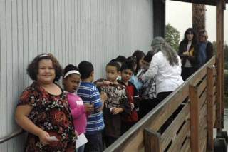 Students from Jodie Hall’s first-grade class at Kent Elementary line up Monday outside their portable classroom. Due to the high numbers of students it has