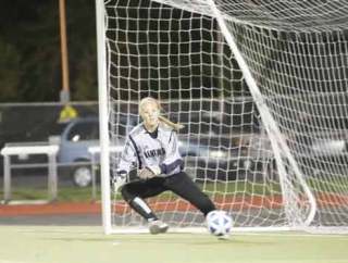 Kentwood goalkeeper Courtney Johnson (above) has combined with teammate Megan Walburn for 14 shutouts this season. The Kentwood defense has allowed just four goals