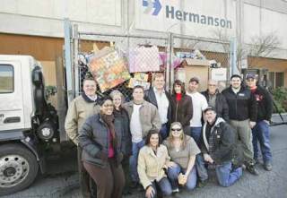 Some of the 300 Hermanson employees who together donated more toys and cash to the Kent Fire Department's Toys for Tots program than any other business.