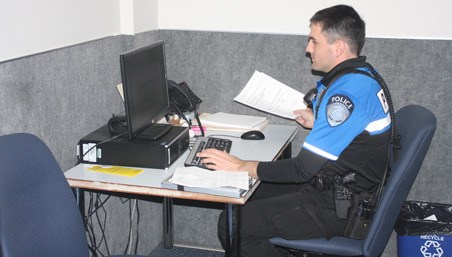 Kent Police officers are crammed into tight work spaces at the current headquarters. Voters will decide in November whether to approve a $34 million bond measure for a new station at the current site.