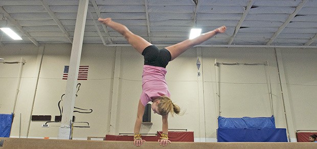 Kentridge’s Ellie Hoekman works on her routine on the balance beam.