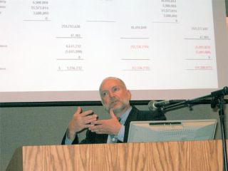 Kent School District Finance Director John Knutson explains to the Kent School Board Wednesday night about how federal stimulus money might not mesh with the funding gaps anticipated in state dollars to the district.