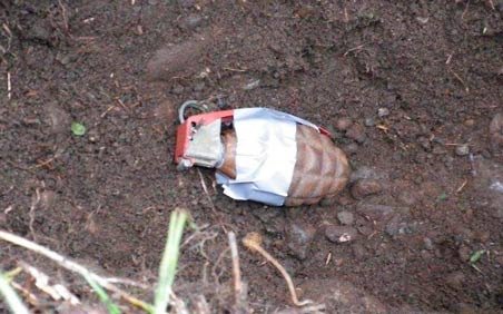 Bomb technicians placed duct tape on a grenade found Monday at a SeaTac intersection inside a box. The grenade did not contain explosives.