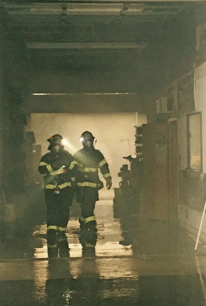 Kent firefighters found a small fire that had been extinguished by the sprinkler system at a business located at the end of a strip mall Thursday night.
