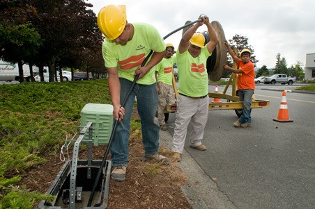 Crews install a new Comcast Business commercial fiber network in north Kent.