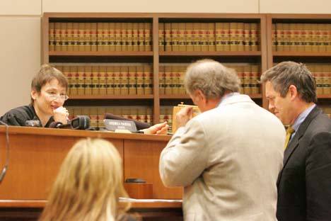 King County Superior Court Judge Andrea Darvas speaks during court proceedings Thursday to attorney Jim Gasper (center