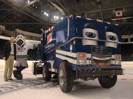 Allied Waste Services’ Chris Guimond stands Wednesday with Seattle Thunderbirds mascot Cool Bird